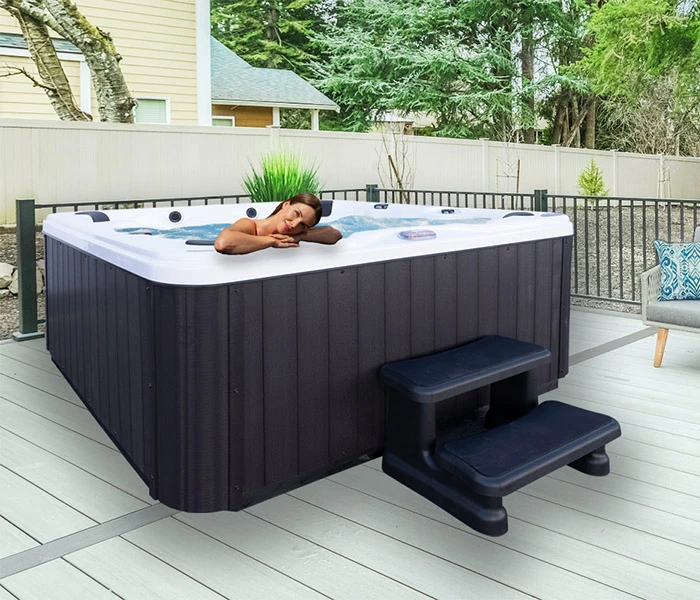 Hot Tubs, Spas, Portable Spas, for sale American Spas American Spas hot tub being used in a family setting